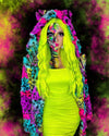 A Woman in SpiritHoods Collector Edition Neon Graffiti Leopard Print Fake Fur Jacket with bright neon green hair and colorful neon skull make up against a vibrant, abstract background. Halloween Make Up Ideas. Halloween Costumes and Animal-themed Halloween Party Outfits