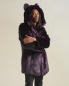 Guy model with dreadlocks and arms crossed frowning at camera while wearing Midnight Wolf Vegan Fur Coat with hood and ears up.