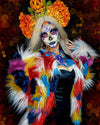 A Woman with colorful Día de Muertos makeup and SpiritHoods alpaca style fake fur patchwork colorful butterfly faux fur coat, with a headband featuring flowers and feathers, against a dark background. Halloween Outfit Ideas. Halloween Costumes