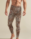Leopard print leggings worn by a man on a beige background - leggings are top-rated men's velvet legging with leopard print throughout