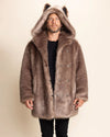 Man wearing a brown fake fur jacket with an oversized hood being worn, showcasing wolf ears, SpiritHoods Fall/Winter Faux Fur Coat Collection and Mens Winter Fake Fur Parkas as seen on Shark Tank
