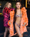 Woman wearing Neon Tiger Limited Edition Classic Faux Fur Coat, front view 2
