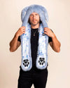 Man wearing a blue bunny ear collector edition faux fur SpiritHood  hat and scarf with paw prints on a beige background