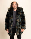 Man wearing a neutral tone camo green and brown fake fur coat with a neutral background
