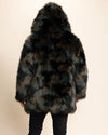 Back of SpiritHoods Camo Cat Green, Brown and Black Patchwork Fake Fur Coat Standing facing the wall with the plush hood on a beige background