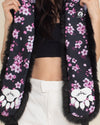 close up photo of SpiritHoods Panda Bear Collector Edition Faux Fur Hood with pink and white cherry blossom flowers throughout and screenprinted panda bear paws in white with SpiritHoods logo in the center