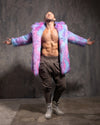 Man wearing a colorful fake fur coat against a gray background