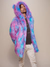 Sly male model with a tilted head and arms behind his back, wearing the Cotton Candy Bear Faux Fur Coat.