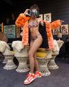 Woman wearing Neon Tiger Limited Edition Classic Faux Fur Coat, front view