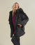 Woman wearing Black Wolf Classic Faux Fur Coat, side view