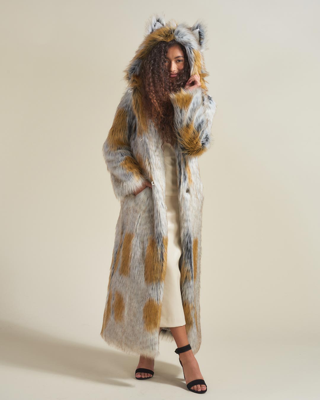 Woman wearing Arctic Fox Classic Faux Fur Long Coat, front view 1