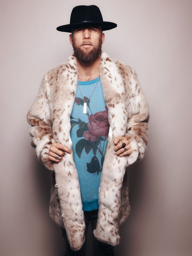 Man wearing Siberian Snow Leopard Collared Faux Fur Coat, front view