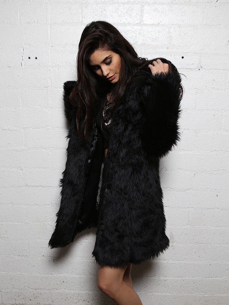 Woman wearing Black Wolf Classic Faux Fur Coat, side view 2