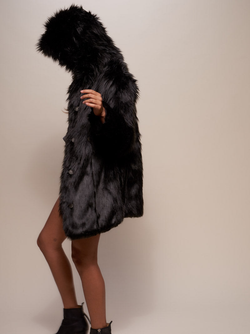 Side View of Woman Wearing Black Wolf Faux Fur Coat with Hood