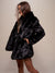 Woman wearing Black Panther Collared Faux Fur Coat, side view 1