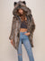 Brunette woman wearing Grey Wolf Classic Coat by Spirit Hoods. She is wearing blue jeans with one hand in her pocket.