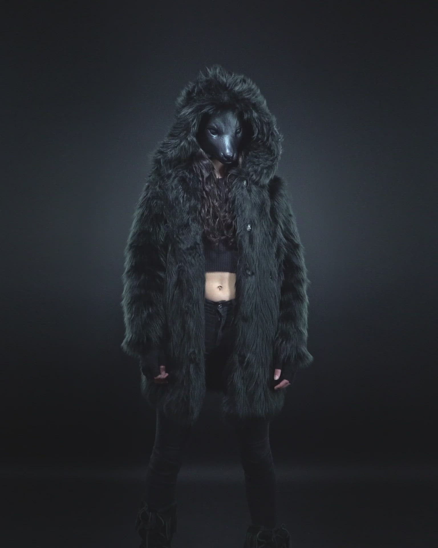 Video of Woman in Wolf Mask Wearing Black Wolf Hooded Faux Fur Coat