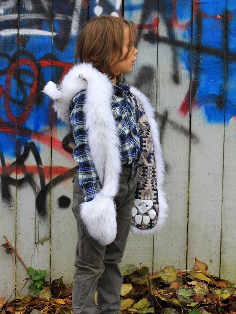 Boy Climbing Fence Wearing Kids Faux Fur SpiritHood in Husky Design
