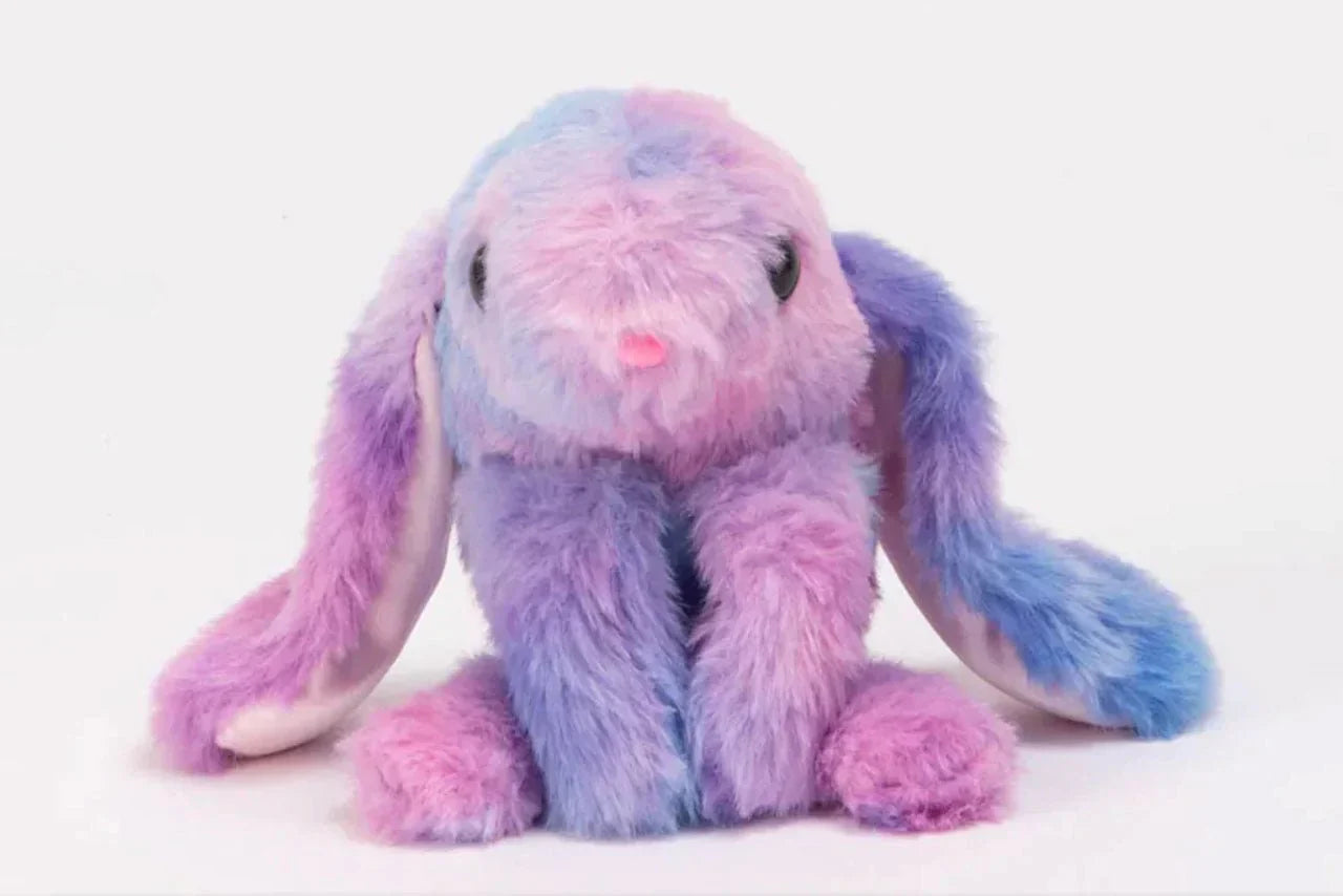 Multicolored plush bunny keychain on a white background