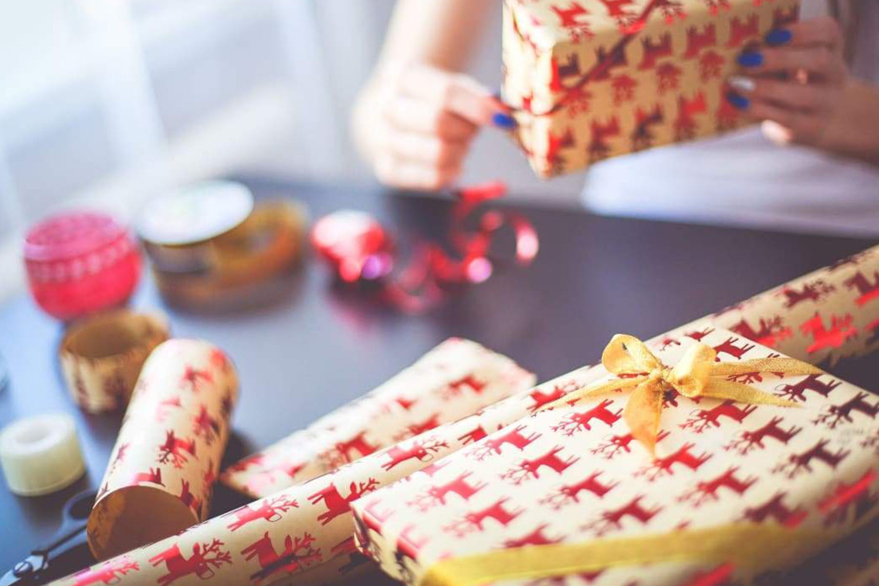 person wrapping gifts
