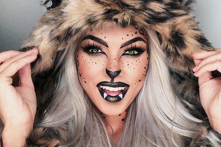 woman wearing faux fur hood with face makeup on
