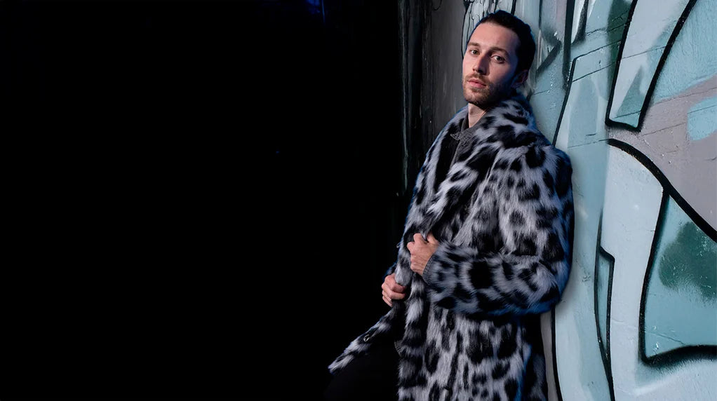 An image of a man wearing a SpiritHoods leopard collared faux fur coat.