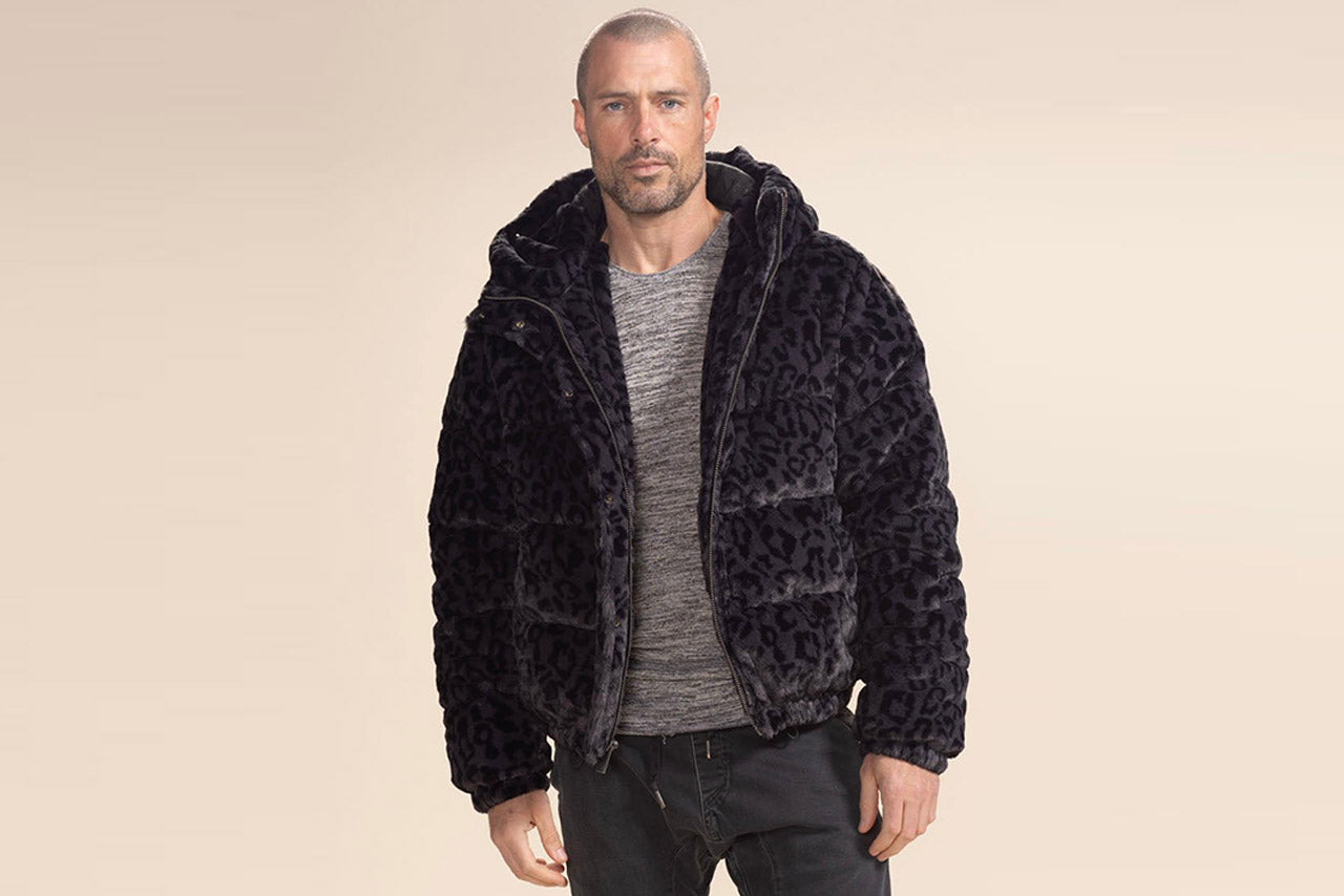 A man wears a SpiritHoods faux fur Puffer Jacket.