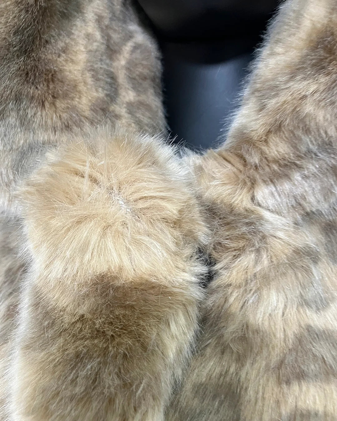Close-up of a fake fur coat with a focus on texture and color. showing some density issues at the lapel. | SpiritHoods Online Sample Sale HOODED Faux Fur Coat in Golden African Cat in Size XXS