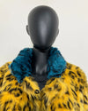 close-up photo of a mannequin wearing SpiritHoods Online Sample Sale Style: Calf Length Faux Fur Coat in Yellow Cheetah size: MEDIUM. show caseing the shorter pile blue cheetah print fake fur collar.