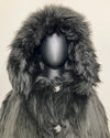 close-up photo of the mannequin with the Hood Up show casing the plush long pile black fake fur and wolf-face buttons. SpiritHoods Online Sample Sale Style: Hooded Faux Fur Coat in Black Wolf size X-SMALL.