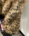 Close-up of a fur coat with a white wall background