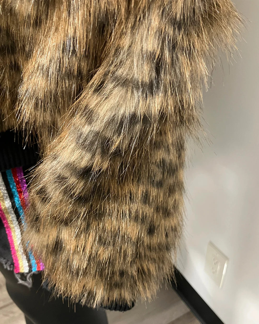 Close-up of a fur coat with a white wall background