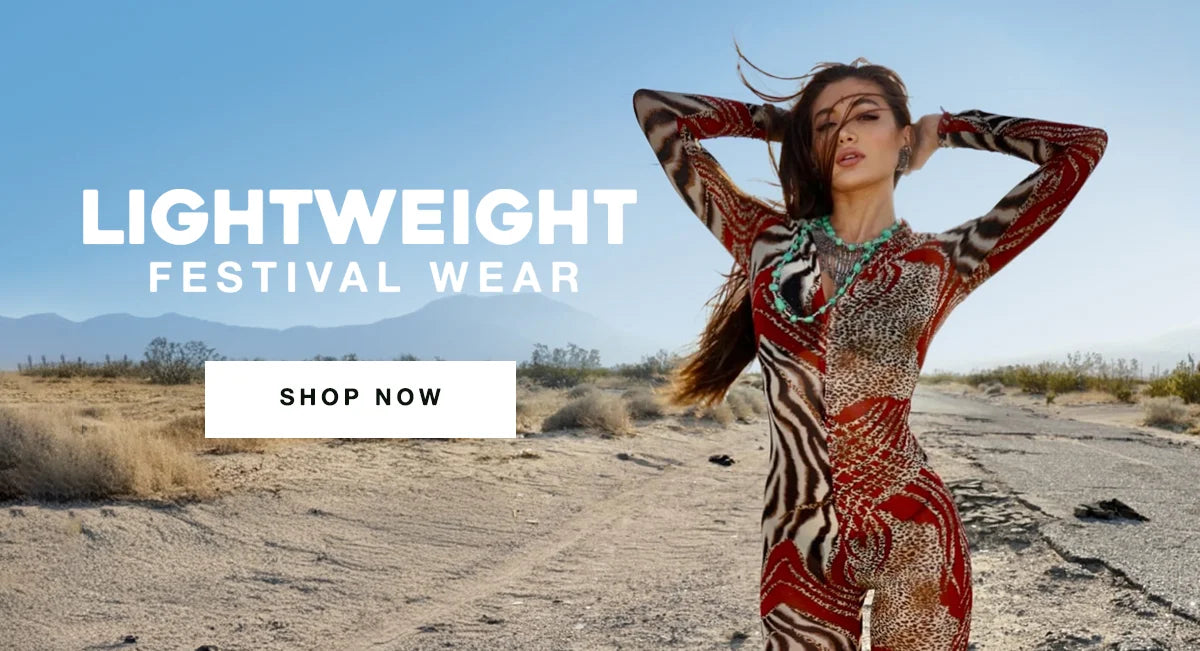 Woman wearing a bold animal-print bodysuit in the desert with wind-blown hair, promoting lightweight festival wear.