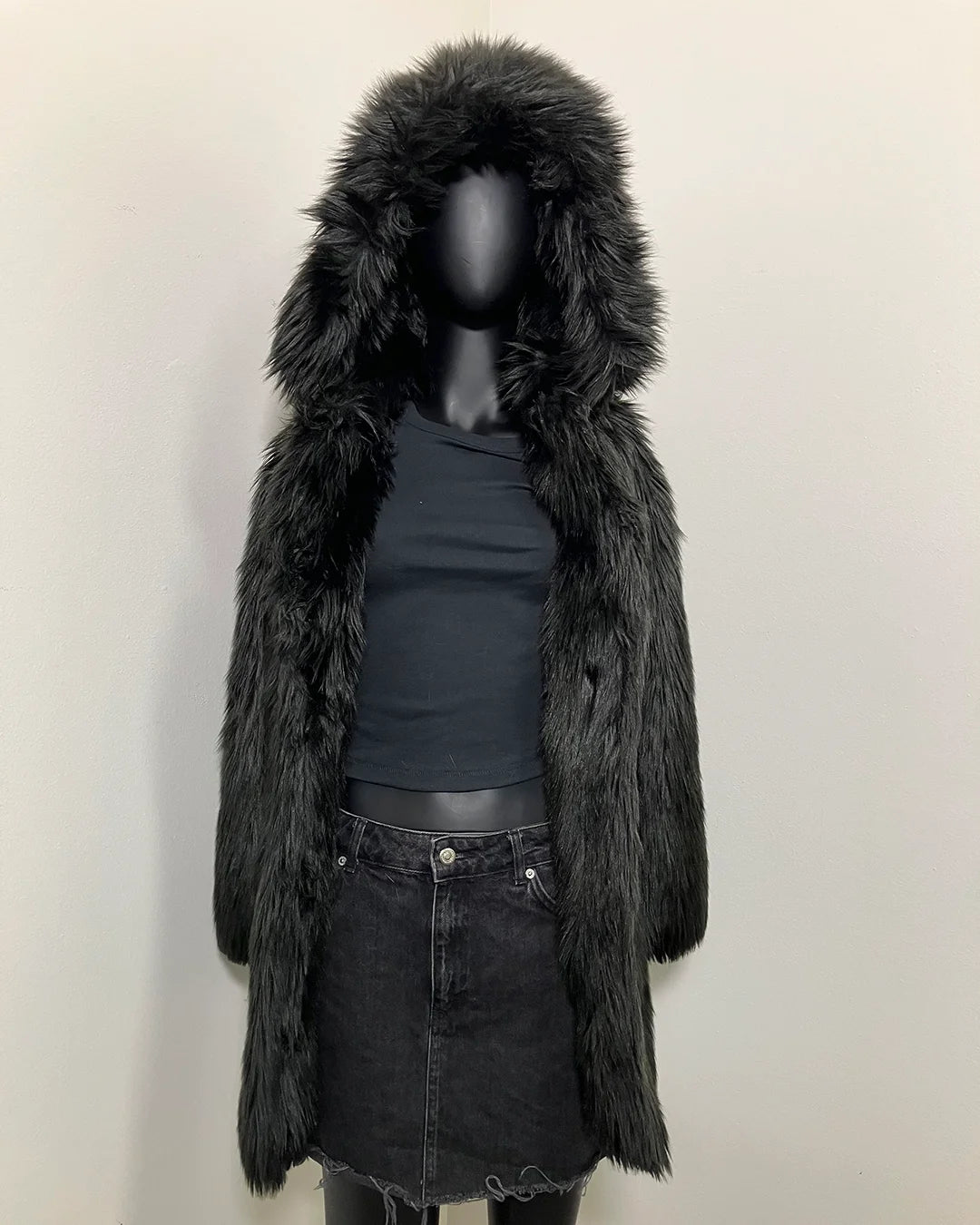 Black faux fur coat with hood on a mannequin against a white background. SpiritHoods Online Sample Sale Style: Hooded Faux Fur Coat in Black Wolf size X-SMALL.
