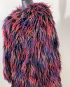 Multicolored fake fur jacket on a mannequin against a neutral background