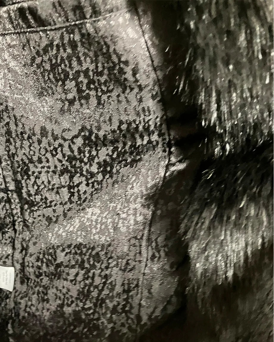 Close-up of a liner fabric with a snakeskin pattern.