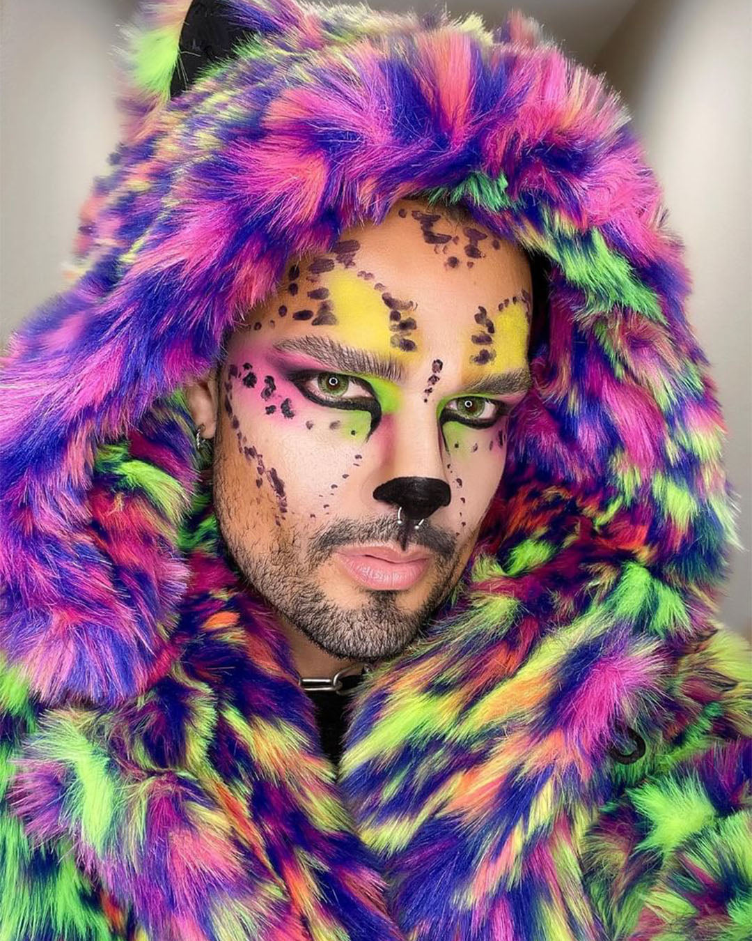 A Man wearing SpiritHoods Neon Disco Kitty Faux Fur Coat with easy neon leopard print make up. Easy Halloween Costume Ideas for Men, Halloween Outfits.