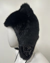 Side angle of black fur hat with decorative elements