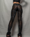 Black animal print festival leggings for women.