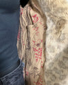 Close-up of a the coats floral-patterned lining | SpiritHoods Online Sample Sale HOODED Faux Fur Coat in Golden African Cat in Size XXS