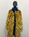 relaxed fit look of the SpiritHoods Online Sample Sale Style: Calf Length Faux Fur Coat in Yellow Cheetah size: MEDIUM on a mannequin wearing the coat open.