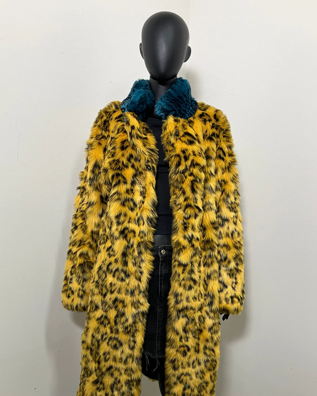 relaxed fit look of the SpiritHoods Online Sample Sale Style: Calf Length Faux Fur Coat in Yellow Cheetah size: MEDIUM on a mannequin wearing the coat open.