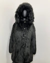 mannequin wearing the Hooded Black Wolf Fake Fur Coat with the hood up and the first row of buttons closed showing the peacoat button closure and wolf face buttons on this XS online sample sale style.