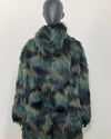 Mannequin wearing a green and black fake fur coat on a white background