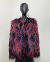Multicolored fake fur bomber jacket on a mannequin against a white background