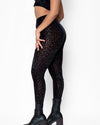 Women's high-waisted animal print black leggings.
