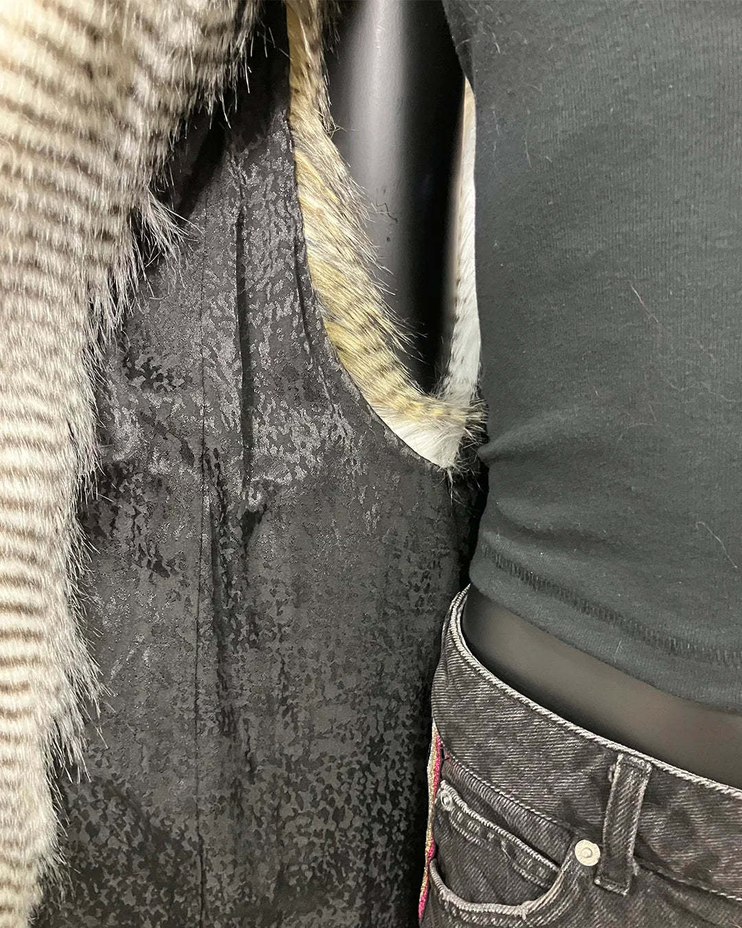 close-up photo of the black snakeskin inspired lining in the SpiritHoods Online Sample Sale Style: Hooded Faux Fur Vest in Alaskan Hawk - Size Medium.
