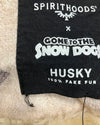 Black label with white text on a fluffy white background