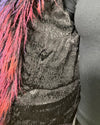 Close-up of a mannequin wearing a dark plush fake fur bomber jacket with a black snakeskin lining, and inner zipper pocket
