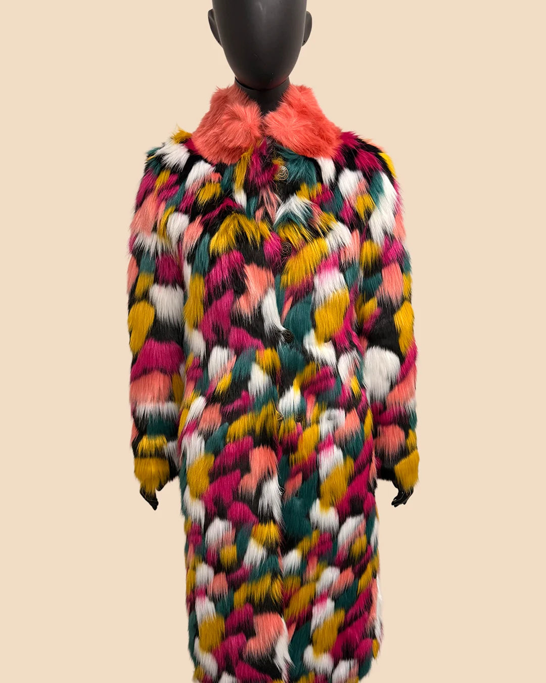 Multicolored fake fur coat on a mannequin against a beige background